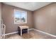 Cozy bedroom featuring neutral walls and a window letting in natural light at 6120 E Southport Rd, Indianapolis, IN 46237