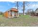 Backyard shed with a covered porch and is located on a spacious lot at 6120 E Southport Rd, Indianapolis, IN 46237