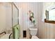 Clean bathroom with a walk-in shower and decorative accents at 6851 Azalea Dr, Indianapolis, IN 46214