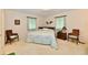 Bedroom featuring a bed, two chairs, and side table with lamp at 6851 Azalea Dr, Indianapolis, IN 46214