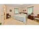 Cozy bedroom featuring a wooden bed frame and plush carpeting at 6851 Azalea Dr, Indianapolis, IN 46214