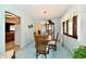 Bright dining room with classic wood furniture and views into other living spaces at 6851 Azalea Dr, Indianapolis, IN 46214