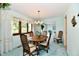 Charming dining room with a wood table, decorative chandelier, and natural light at 6851 Azalea Dr, Indianapolis, IN 46214