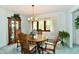 Dining room with wood table, chairs, and natural light through a window at 6851 Azalea Dr, Indianapolis, IN 46214