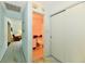Hallway with bathroom access and multiple doors leading to other rooms at 6851 Azalea Dr, Indianapolis, IN 46214