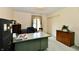 Spacious home office featuring a large desk and storage cabinets at 6851 Azalea Dr, Indianapolis, IN 46214