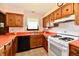 Efficient kitchen with ample cabinet space, light countertops, and modern appliances at 6851 Azalea Dr, Indianapolis, IN 46214