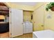 Bright laundry room with included washer and dryer for modern convenience and storage at 6851 Azalea Dr, Indianapolis, IN 46214
