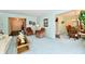 Bright living room showcasing comfortable seating and an open layout to the dining area at 6851 Azalea Dr, Indianapolis, IN 46214
