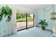 Bright living room featuring a sliding glass door to the outdoor deck at 6851 Azalea Dr, Indianapolis, IN 46214
