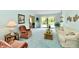Spacious living room with plush armchairs and a view of the backyard at 6851 Azalea Dr, Indianapolis, IN 46214