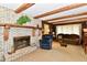 Inviting living room features fireplace with wooden beams, comfortable seating, and natural light at 6851 Azalea Dr, Indianapolis, IN 46214