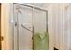 Tiled shower with sliding glass doors and accessibility features at 6851 Azalea Dr, Indianapolis, IN 46214