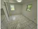 Bright bedroom space with marble floors, complemented by ample natural light from two windows at 7831 E 46Th St, Indianapolis, IN 46226