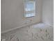 Clean and simple bedroom design with modern marble tile flooring and white walls for a minimalist aesthetic at 7831 E 46Th St, Indianapolis, IN 46226