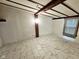 Bedroom with beamed ceiling and modern tiled flooring at 7831 E 46Th St, Indianapolis, IN 46226
