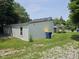 Rear view of the home featuring a neatly kept lawn and white siding at 7831 E 46Th St, Indianapolis, IN 46226