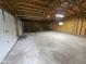 Spacious two-car garage features unfinished walls, high ceilings and an automatic garage door at 7831 E 46Th St, Indianapolis, IN 46226