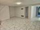 Spacious living room featuring stylish marble tile floors, freshly painted white walls and neutral design at 7831 E 46Th St, Indianapolis, IN 46226