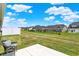 Expansive backyard features a patio with a chair, a well-kept lawn, and a view of neighboring homes and fences at 843 Garrow Dr, Westfield, IN 46074