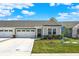 Inviting single-story home featuring an attached two-car garage and meticulously maintained front yard landscaping at 843 Garrow Dr, Westfield, IN 46074