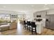 Open-concept kitchen with an island, seating, stainless steel appliances, and seamless flow to dining area at 843 Garrow Dr, Westfield, IN 46074