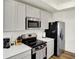 Well-equipped kitchen featuring modern appliances, ample counter space, and sleek cabinetry at 843 Garrow Dr, Westfield, IN 46074