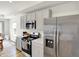 Contemporary kitchen with stainless steel appliances, light gray cabinets, and abundant counter space at 843 Garrow Dr, Westfield, IN 46074