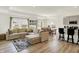 Comfortable living room with neutral decor, large windows, and open access to the kitchen and dining areas at 843 Garrow Dr, Westfield, IN 46074