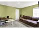 Home office featuring green walls, desk and chair, a couch and window with natural light at 843 Garrow Dr, Westfield, IN 46074
