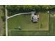 Overhead shot highlighting the property's layout, long driveway, and verdant surroundings with neighboring farmland at 8785 W 100 N, Anderson, IN 46011