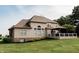 Expansive home backyard featuring a deck, gazebo, lush lawn and beautiful landscaping at 8785 W 100 N, Anderson, IN 46011