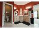 Bathroom with double vanity sinks, decorative mirrors, and ample counter space at 8785 W 100 N, Anderson, IN 46011
