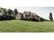 Well-maintained home with manicured lawn and mature trees, offering a serene and inviting atmosphere at 8785 W 100 N, Anderson, IN 46011