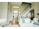 Inviting foyer with hardwood floors, staircase, and comfortable seating at 8785 W 100 N, Anderson, IN 46011