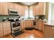 Updated kitchen featuring stainless steel appliances and wooden cabinets at 8785 W 100 N, Anderson, IN 46011
