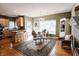 Eat-in kitchen with bar seating, a glass table, and a decorative rug at 8785 W 100 N, Anderson, IN 46011