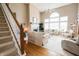 Spacious living room with large windows, fireplace, hardwood floors, and neutral furniture at 8785 W 100 N, Anderson, IN 46011