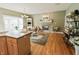 Open concept living room with fireplace, hardwood floors, and natural light at 8785 W 100 N, Anderson, IN 46011