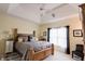 Comfortable main bedroom featuring a tray ceiling, carpet floors, and ample natural light at 8785 W 100 N, Anderson, IN 46011