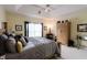 Spacious main bedroom featuring tray ceilings, carpet floors, and ample natural light at 8785 W 100 N, Anderson, IN 46011