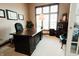 Well-lit office space featuring a large desk, comfortable seating, and ample room for productivity at 8785 W 100 N, Anderson, IN 46011