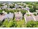 Aerial view showcasing the house with a wooden deck, surrounded by lush greenery in a vibrant, Gathering-friendly neighborhood at 8877 N White Tail Trl, McCordsville, IN 46055