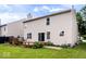 Spacious backyard featuring a deck, lush lawn, and sliding glass doors to the home at 8877 N White Tail Trl, McCordsville, IN 46055