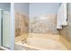 Inviting bathroom showcases a soaking tub with tile surround and glass door shower at 8877 N White Tail Trl, McCordsville, IN 46055