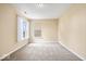 Bright bedroom featuring neutral carpet, light-colored walls, and natural light from two windows at 8877 N White Tail Trl, McCordsville, IN 46055