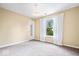 Bright bedroom features carpet, a large window, and neutral paint at 8877 N White Tail Trl, McCordsville, IN 46055