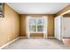 Cozy bedroom featuring a bright window with decorative curtains and neutral walls at 8877 N White Tail Trl, McCordsville, IN 46055