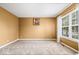 Comfortable bedroom with neutral carpet, a picture window, and neutral paint at 8877 N White Tail Trl, McCordsville, IN 46055