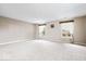 Large bonus room with carpet, neutral walls, and windows for natural light at 8877 N White Tail Trl, McCordsville, IN 46055